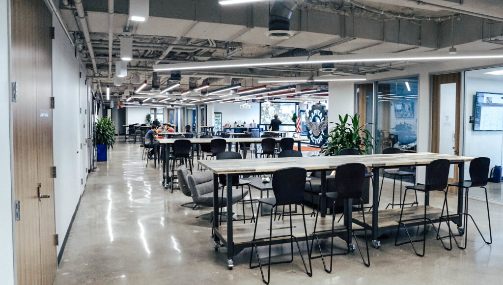 Capital Factory coworking space in downtown Austin with communal work tables and industrial design