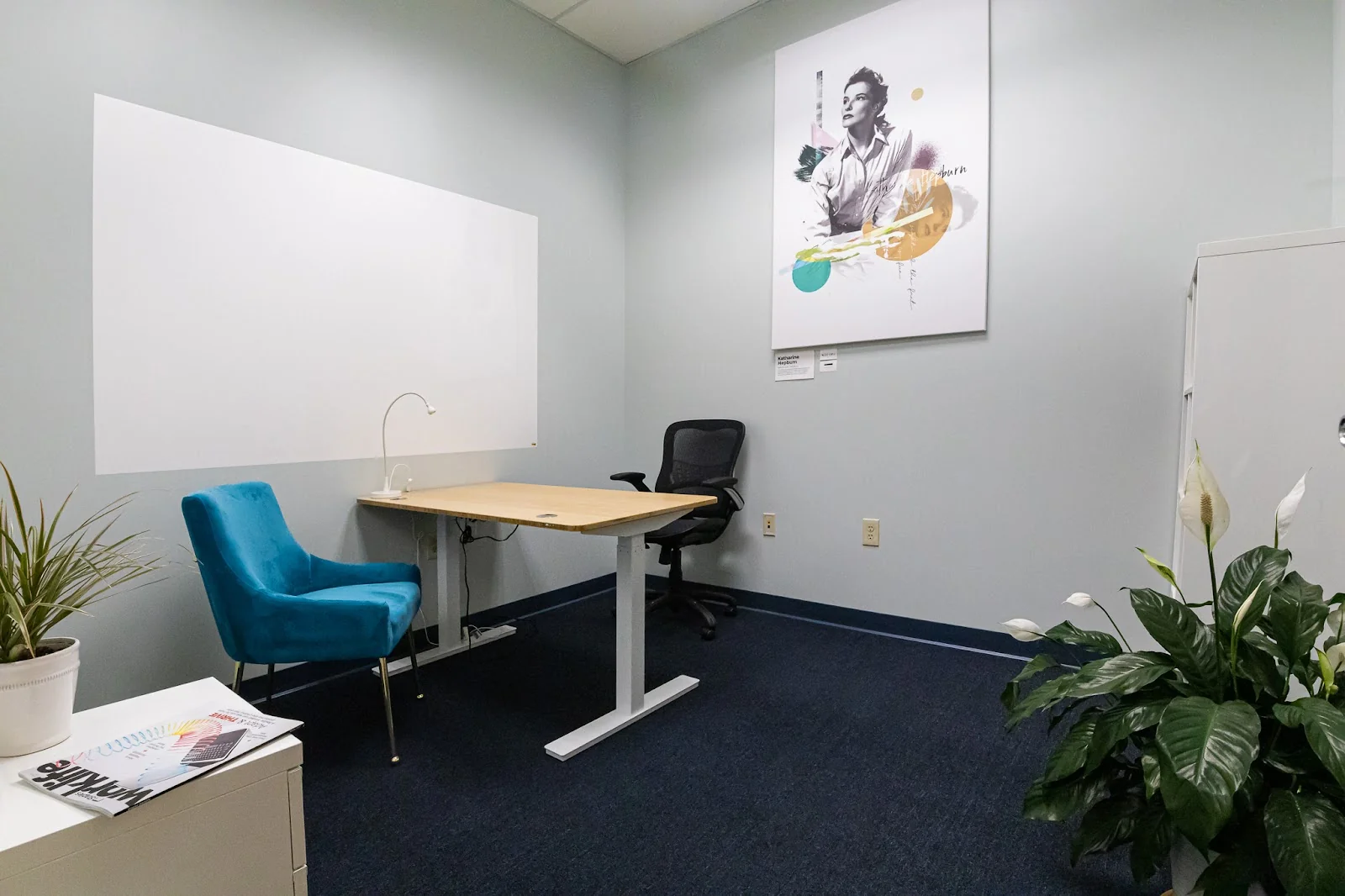 West Hartford CoWorking - private office with standing desk, teal velvet chair, and Katharine Hepburn artwork