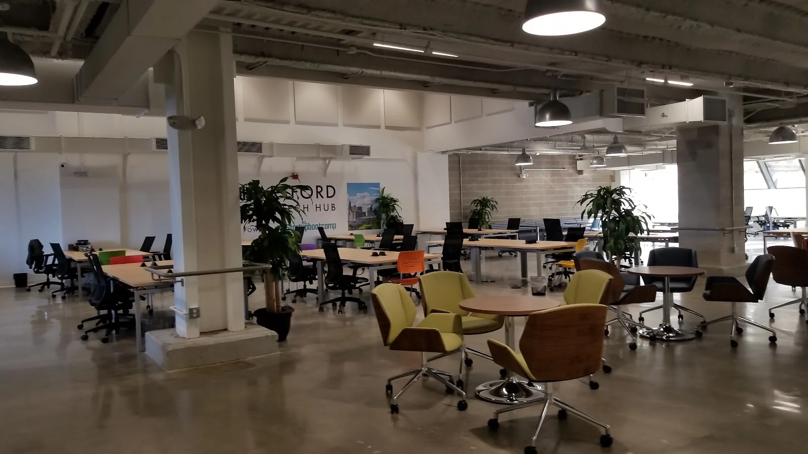The Mezz Hartford - large industrial coworking with Hartford Tech Hub sign and colorful seating