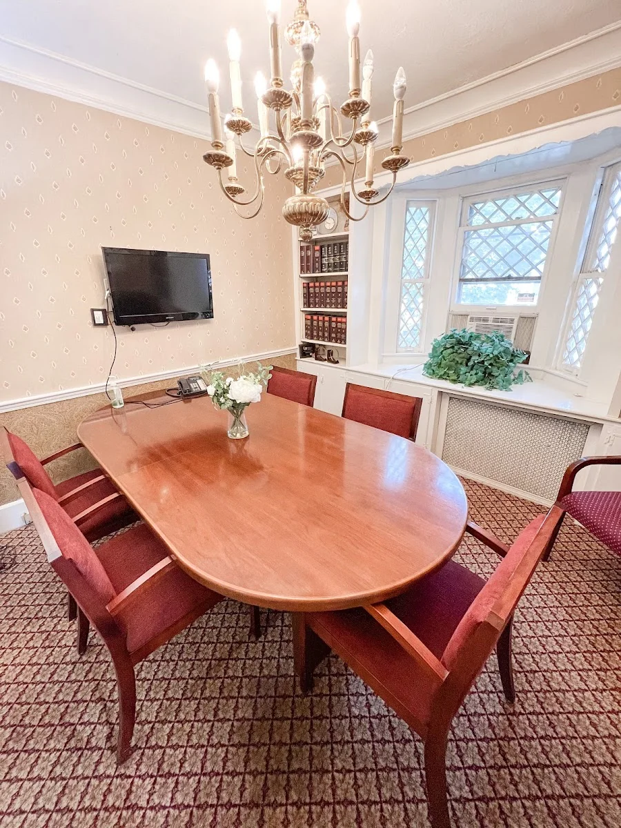 Main Street Office Center - traditional conference room with chandelier, cherry table, and law books