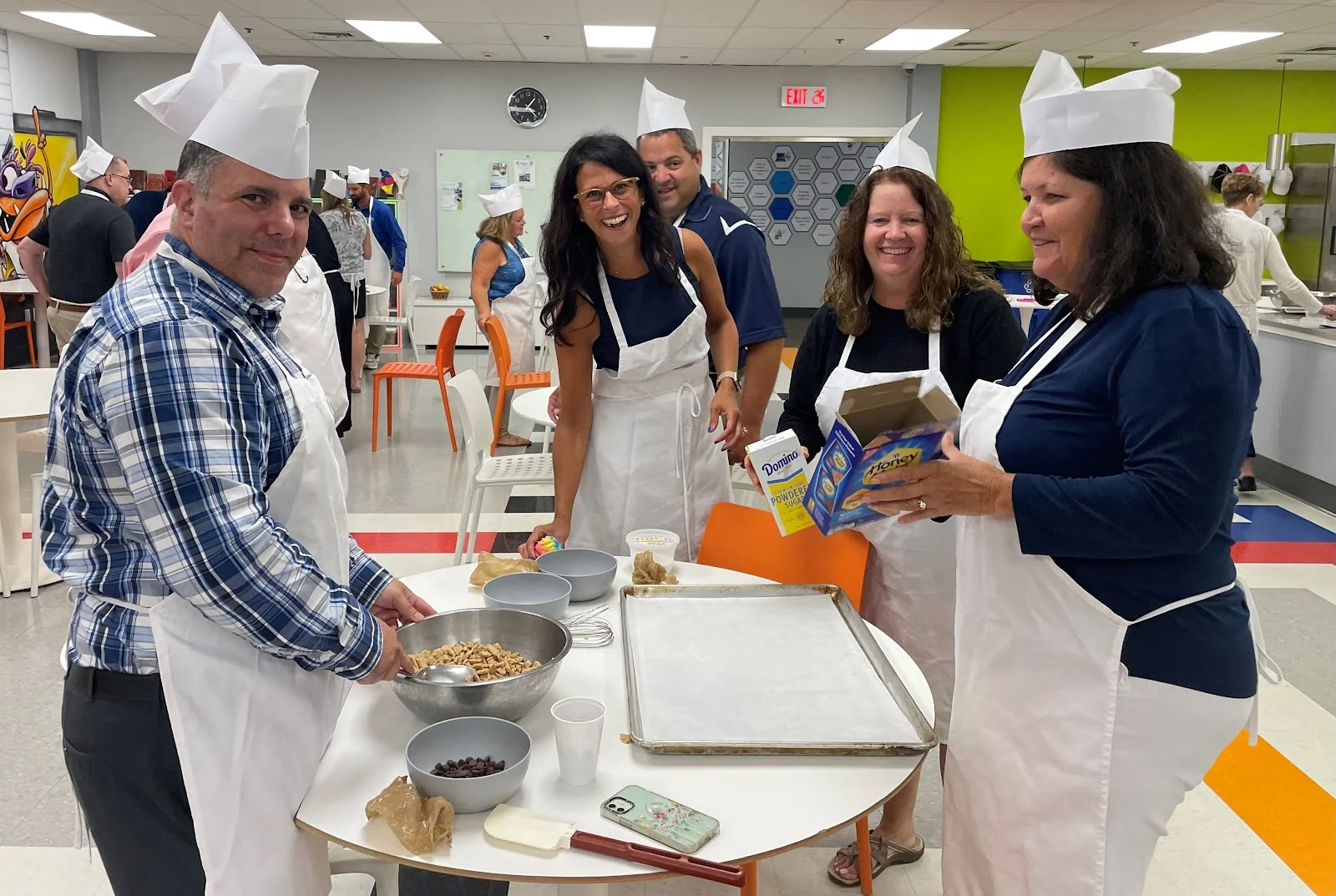 WorkspaceCT Bethel - team building cooking event with chef hats in commercial kitchen