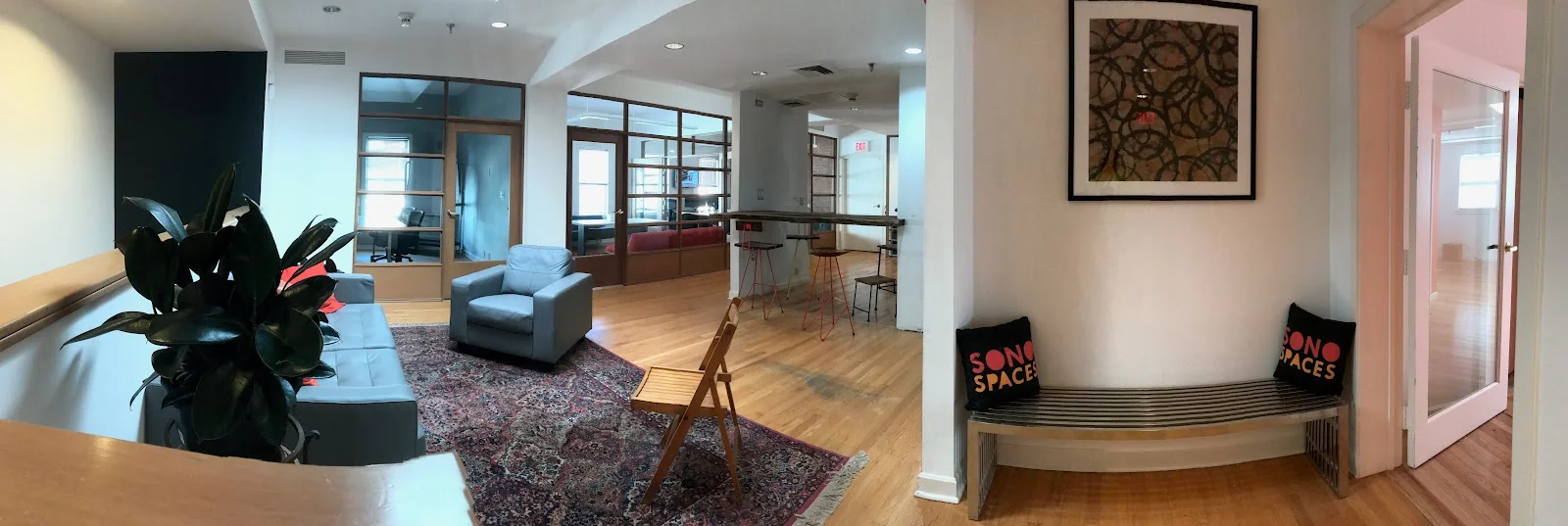 sono spaces Norwalk - loft-style coworking with hardwood floors and SoNo Spaces branded pillows