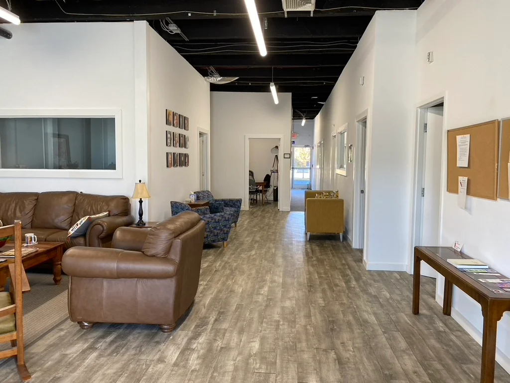Fairfield County Story Lab - casual lounge with leather couches and exposed ceiling
