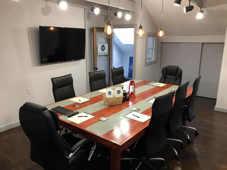 The Work Station Madison - boardroom with custom wood table and industrial pendant lights