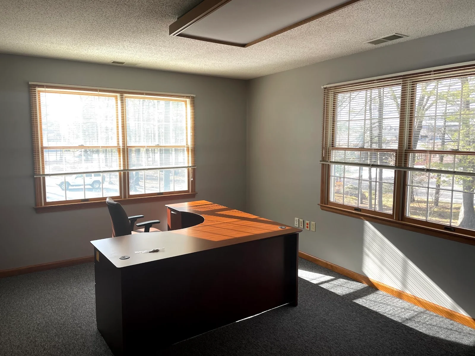 The Workhaus Farmington - private office with L-shaped desk and natural light
