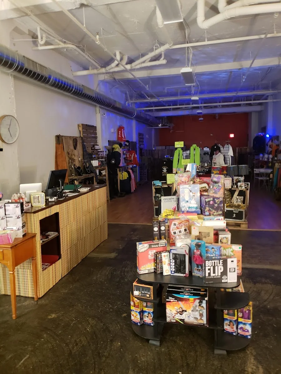 Collab Exchange Bridgeport - creative maker space with blue lighting and merchandise displays