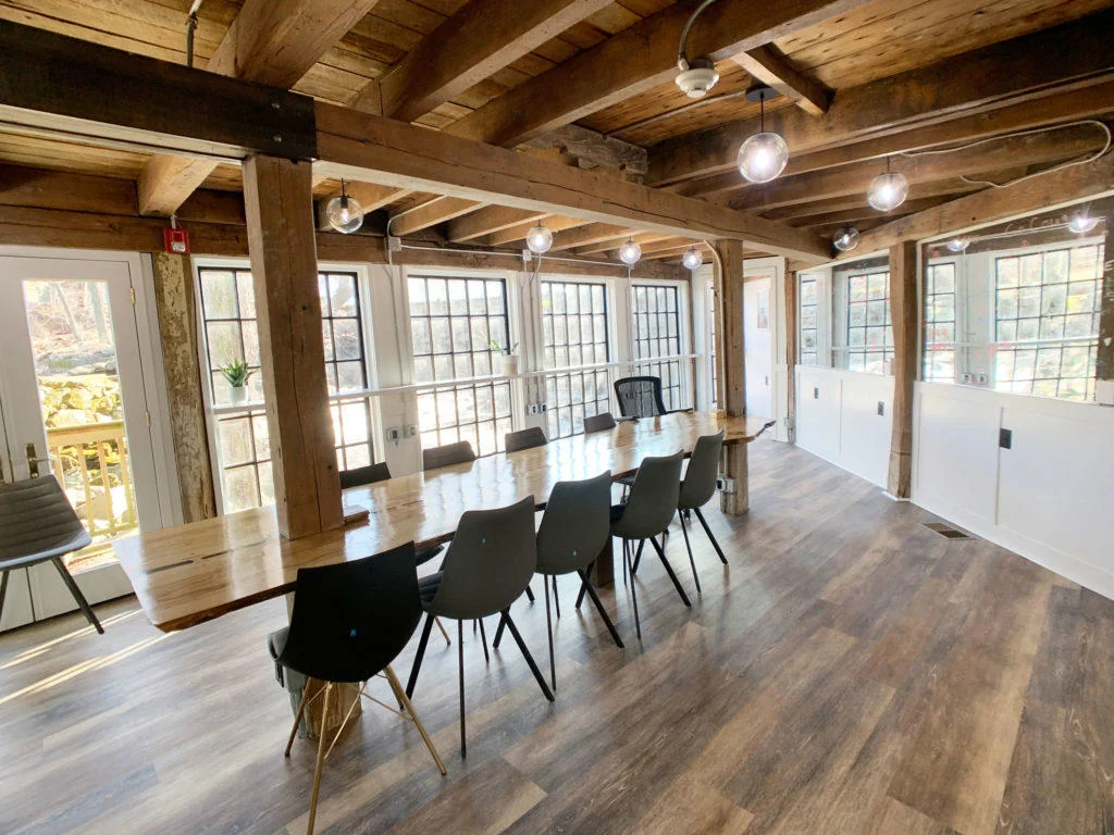 B@Work Westport - rustic barn conference room with exposed timber beams and live-edge wood table