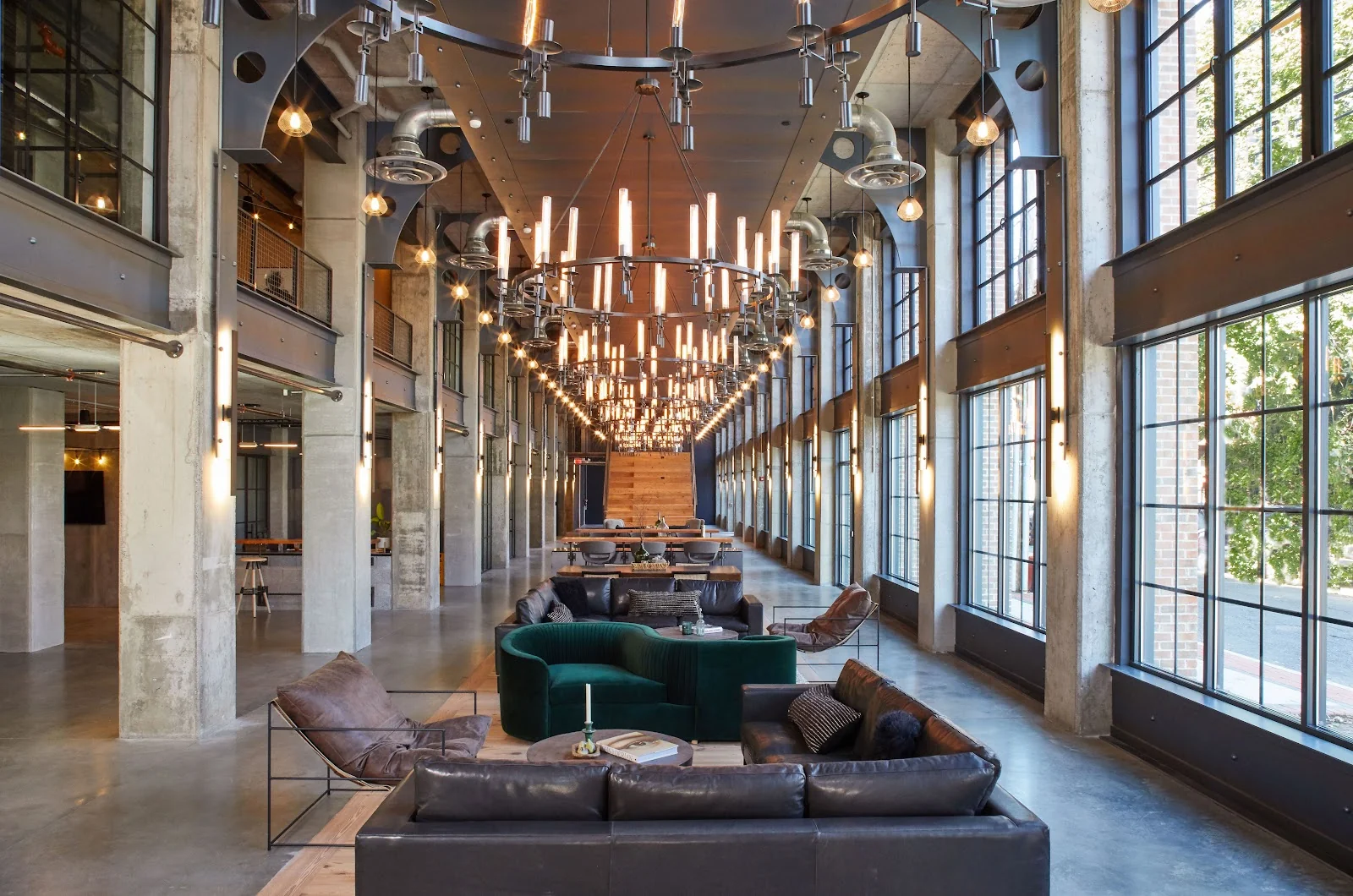 SonoCo Coworking Center Norwalk - stunning industrial cathedral with dramatic chandeliers and leather sofas