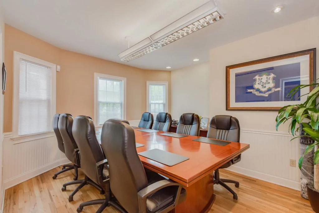 Creative Collaborative Community East Hartford - traditional executive boardroom with cherry table and Connecticut state flag