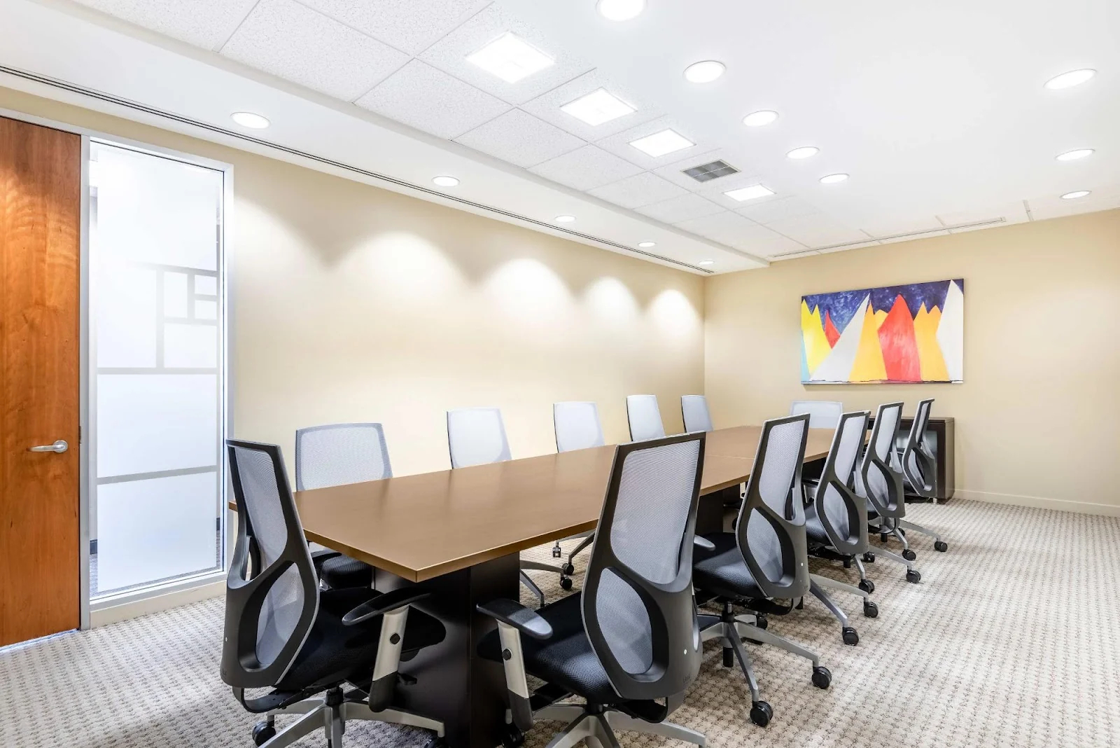 Regus Stamford One Stamford Plaza - modern boardroom with colorful abstract mountain artwork