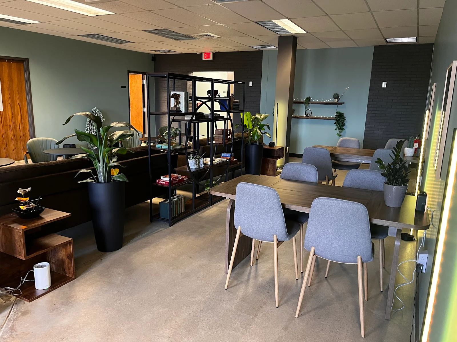 CoLab49 Middletown - modern industrial coworking with sage green walls and wooden tables