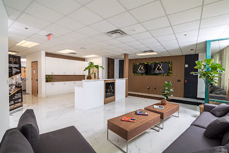 Arixza Corporates upscale marble-floored lobby with white reception desk and wood-paneled accent wall